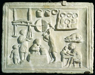 Relief, das das Innere einer Schmiede darstellt